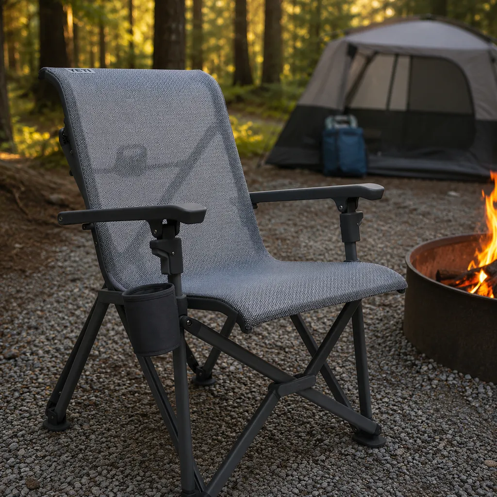 YETI Trailhead camp chair on gravel beside a fire ring in evening light