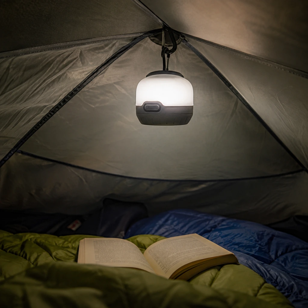 Black Diamond Moji lantern clipped to a tent ceiling loop above sleeping bags