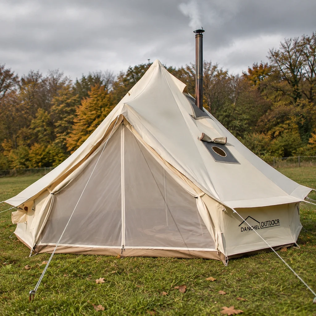 DANCHEL OUTDOOR B5PRO bell tent with a wood stove flue rising from the roof jack