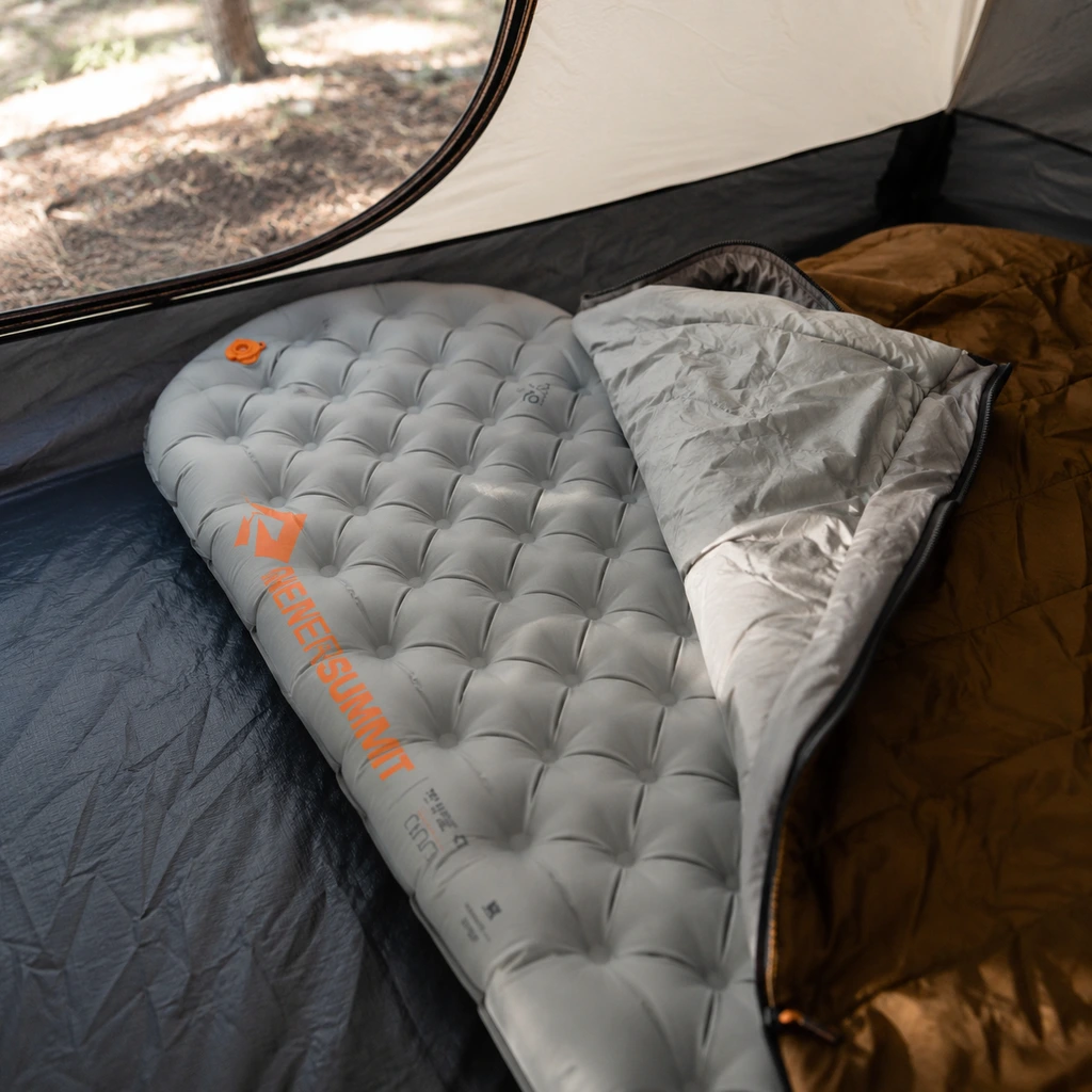 Sea to Summit Ether Light XT thick pad with a sleeping bag on a tent floor