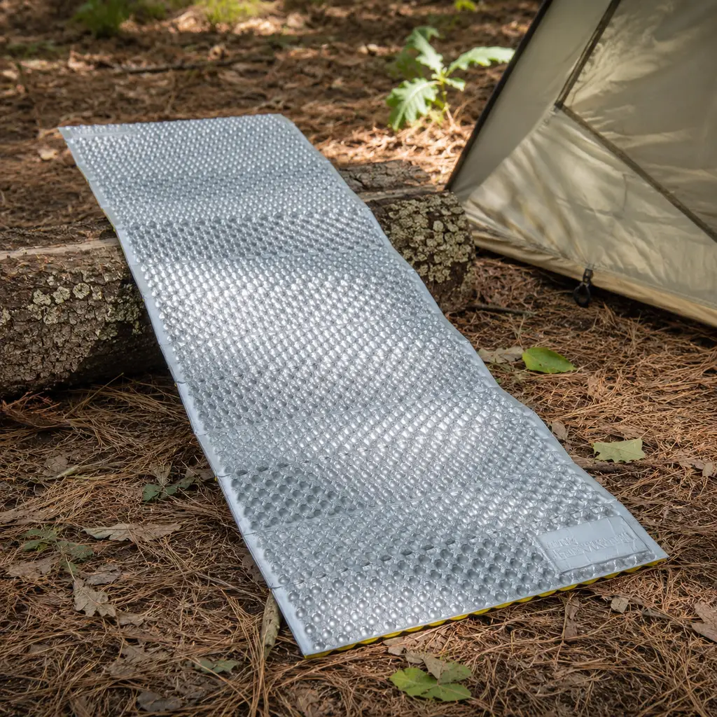 Therm-a-Rest Z Lite Sol folding foam mat unfolded beside a tent