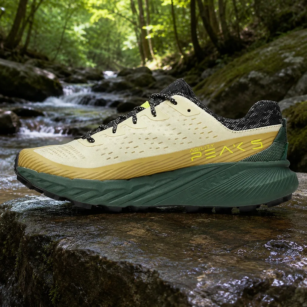 Merrell Agility Peak 5 trail running shoe on a wet rock slab by a stream