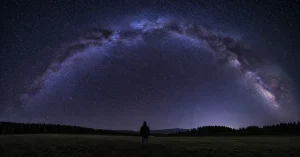 Stargazing for beginners, the Milky Way over a dark open meadow at night