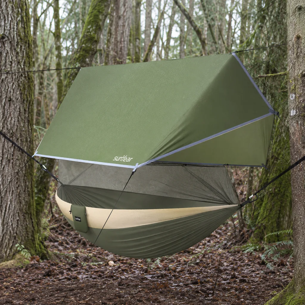 Sunyear hammock with bug net and rain tarp at a woodland campsite