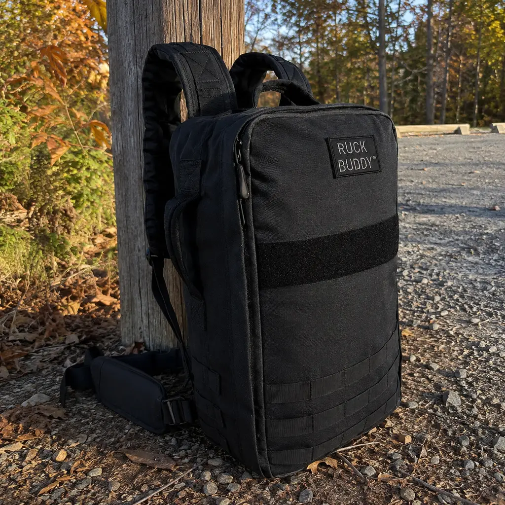 RuckBuddy RuckPack 25L with its padded hip belt against a wooden trailhead post