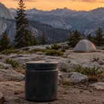 Bear canister set well away from a backpacking tent at a Yosemite backcountry campsite
